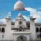 Hearing underway on petitions to revisit abolition of caretaker system